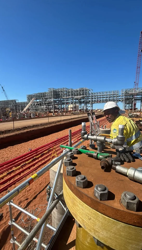 Working on pipework at a mine construction site in the Pilbara