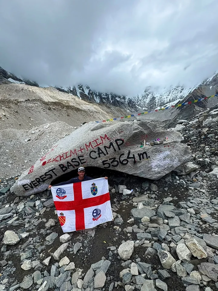 Holding a Bolton Wanderers flag at Everest Base Camp in Nepal